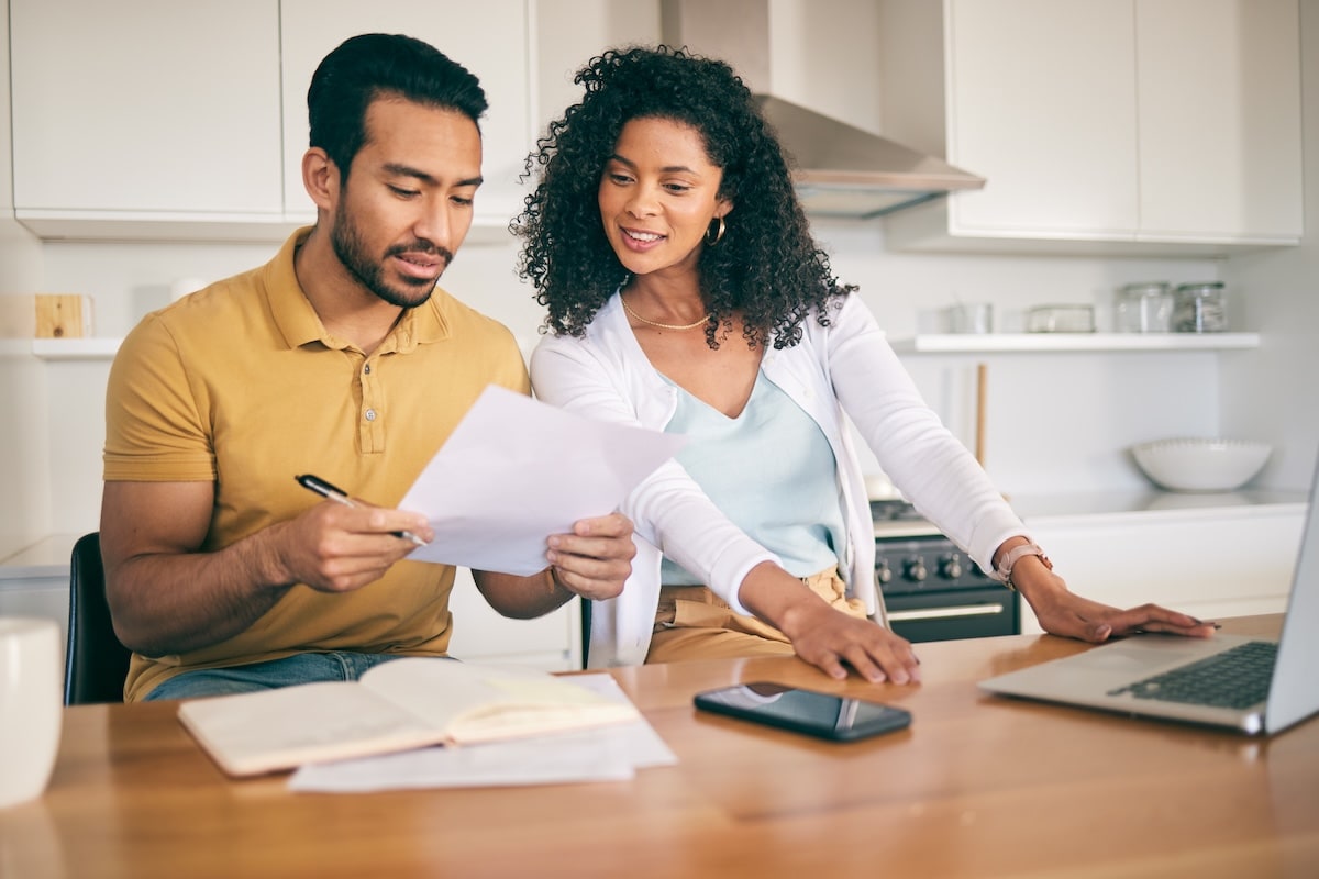 Couple reviewing home equity loan paperwork together