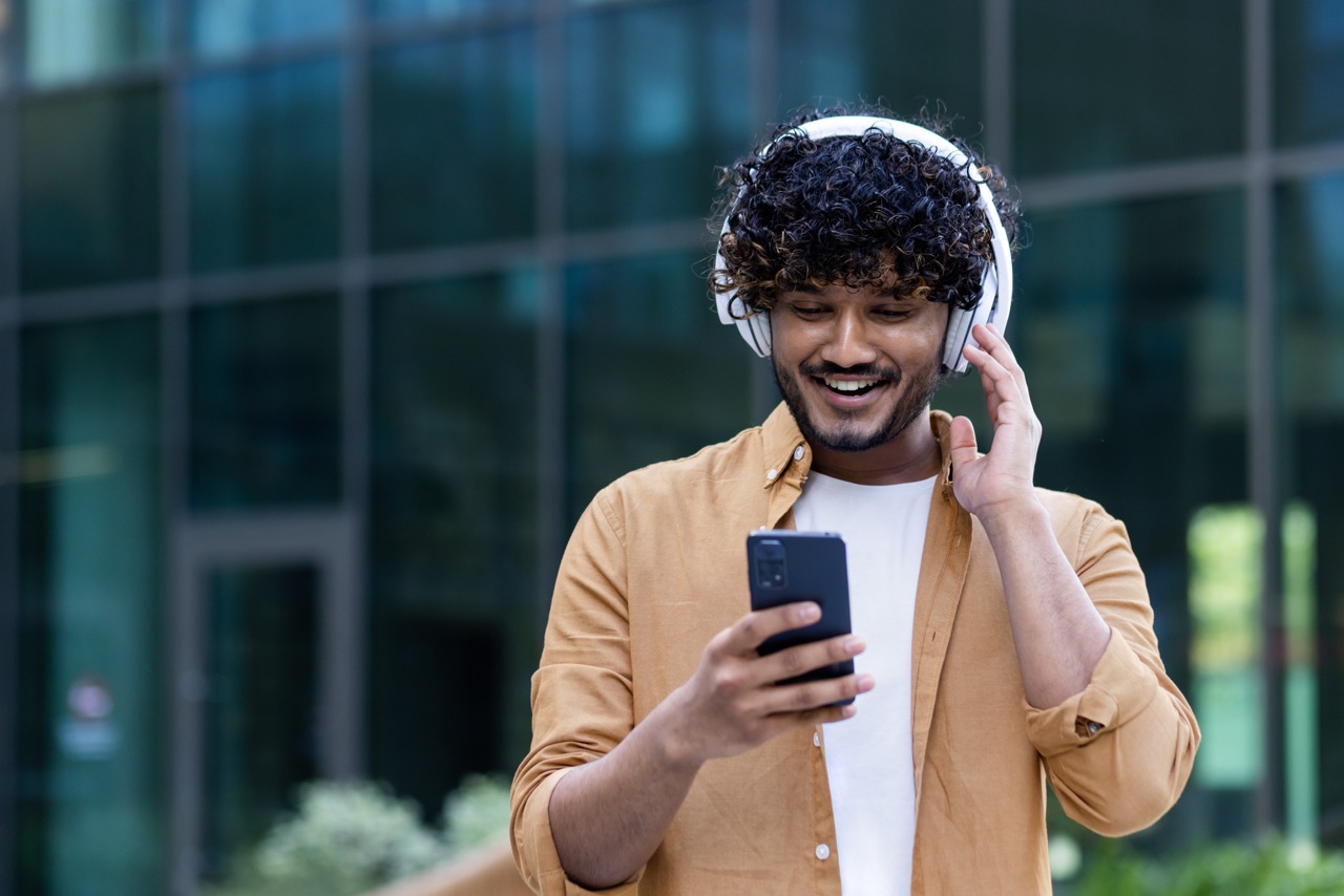 Person listening to a podcast with headphones