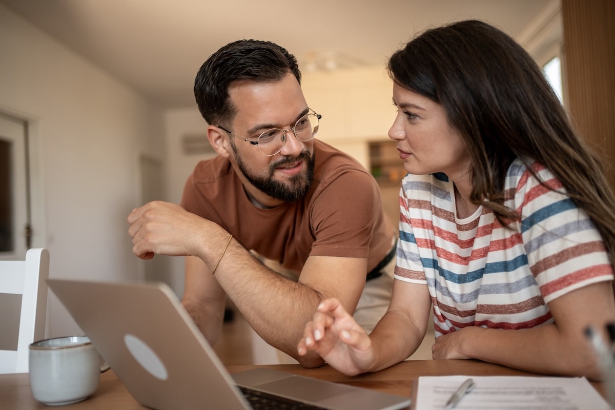 Couple comparing home equity options on a laptop