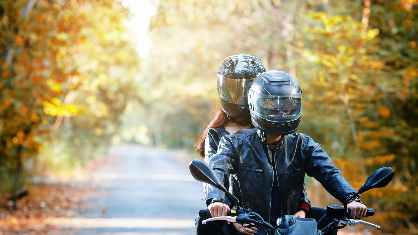 Motorcycle riders on a scenic road