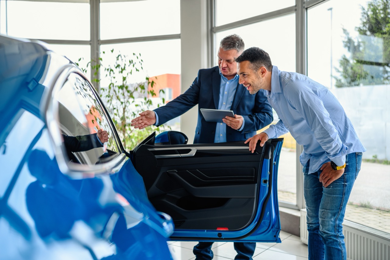 Customer looking at a brand-new vehicle at a dealership