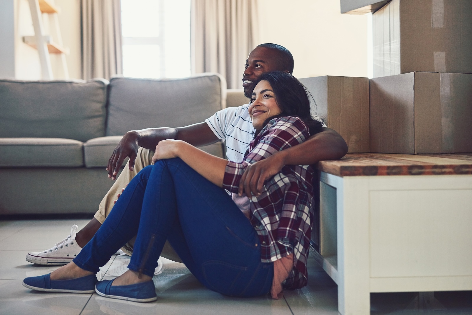 Happy homeowners settling into a new home