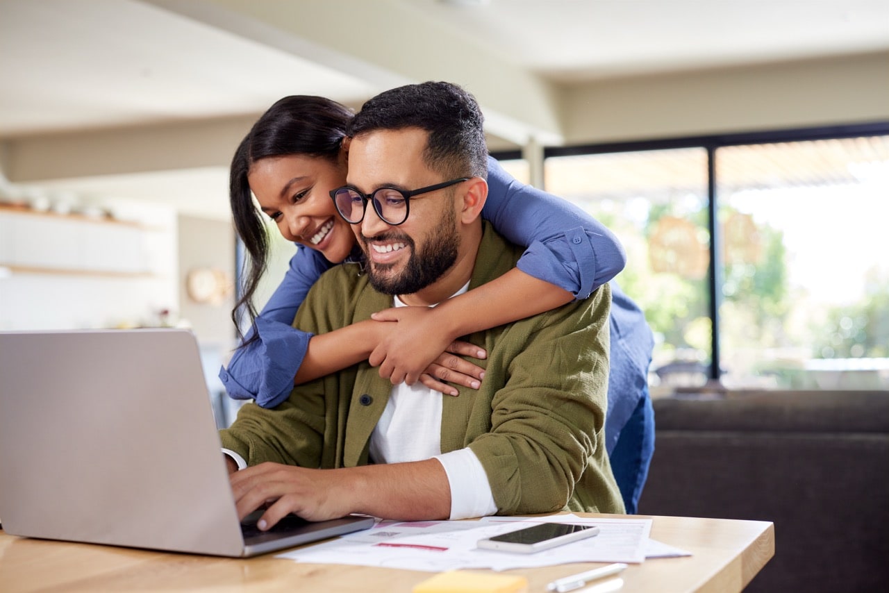 Couple reviewing loan options online