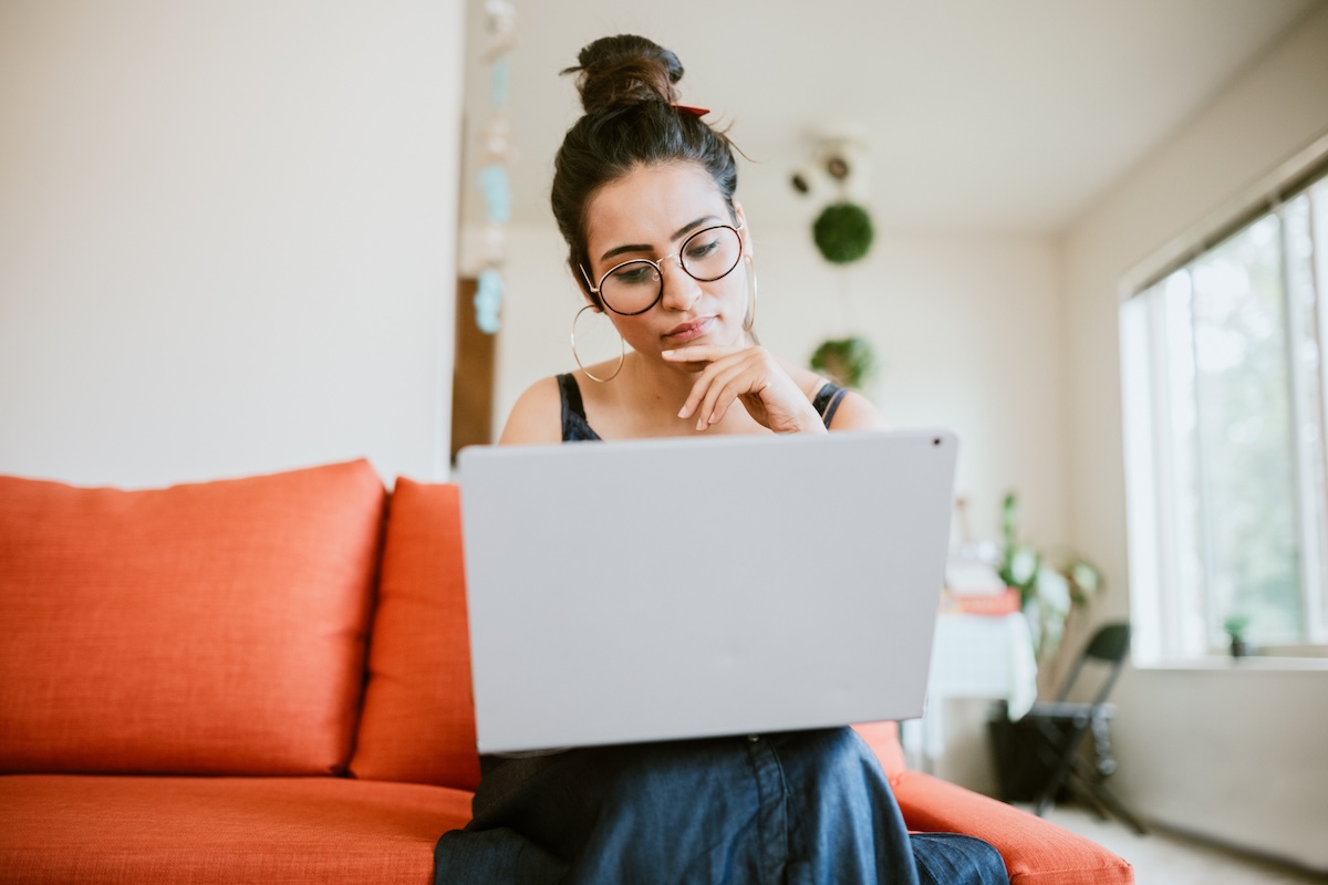 Homeowner using a laptop to manage home equity financing