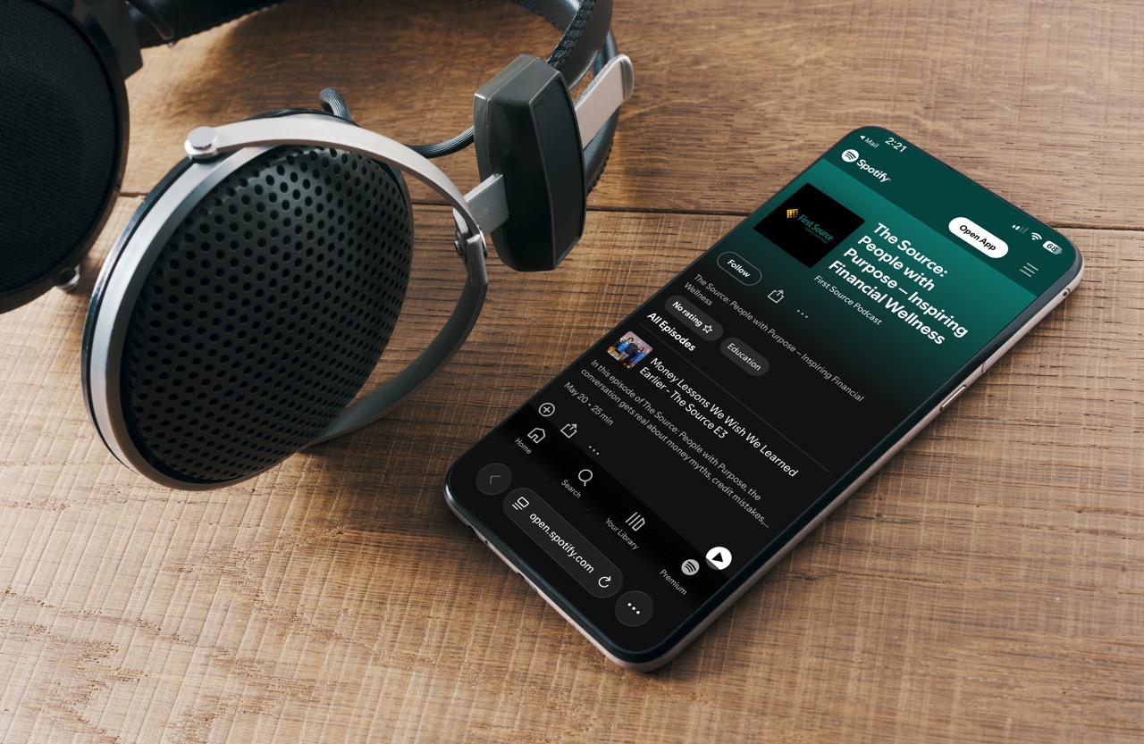 Headphones and phone ready for listening to a podcast