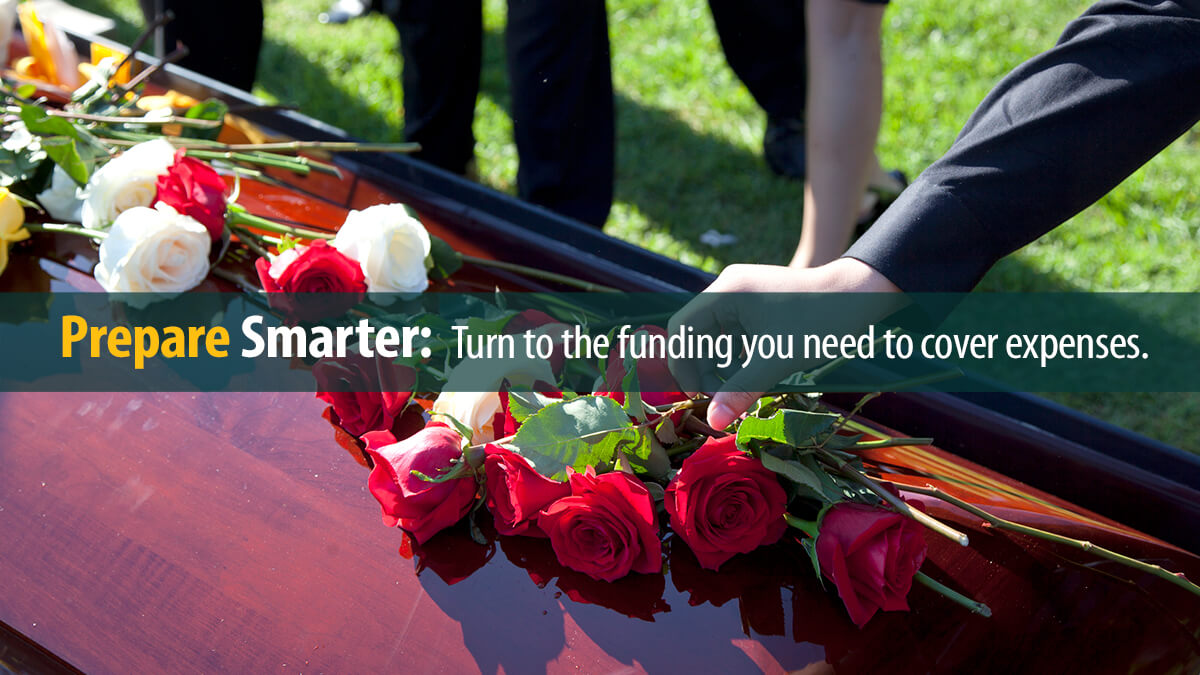Roses and flowers on top of a casket.