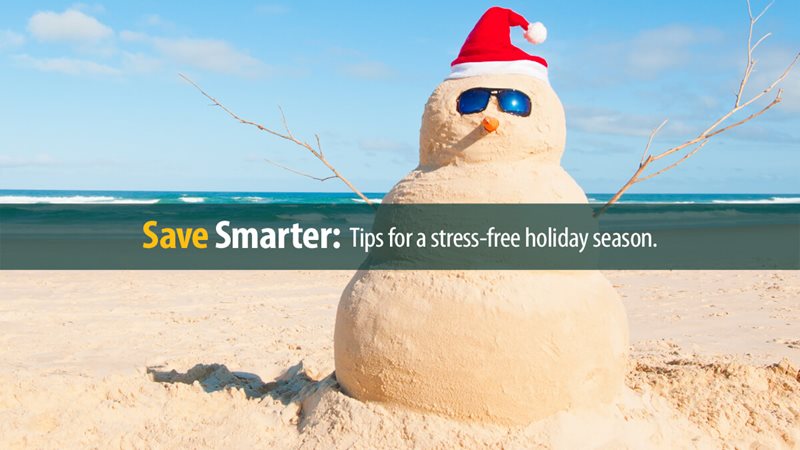 Snowman at the beach with sun glasses.