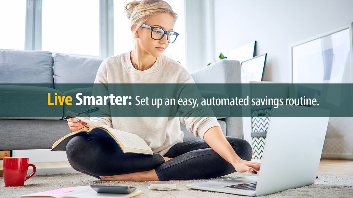 Young woman using laptop paying bills online and managing home budget