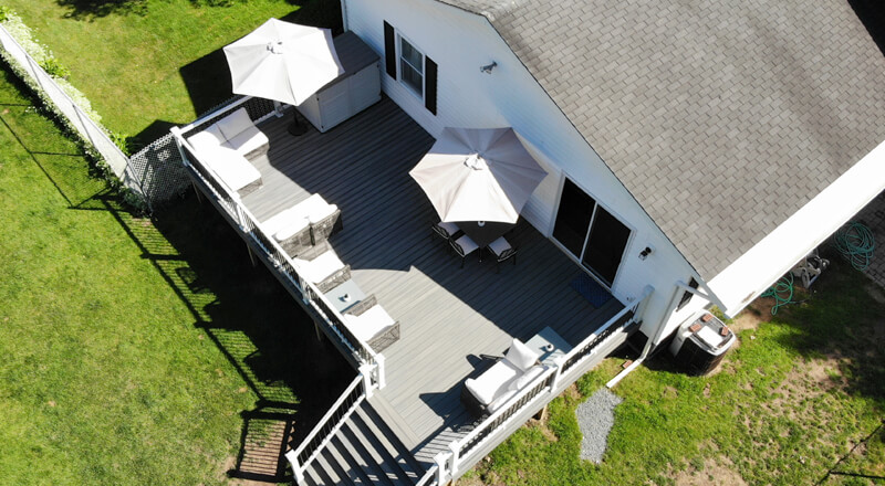 Suburban home backyard view with a deck.