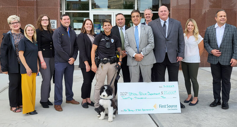 Penny the Therapy Dog is introduced as the newest member of the Utica Police Department at City Hall.