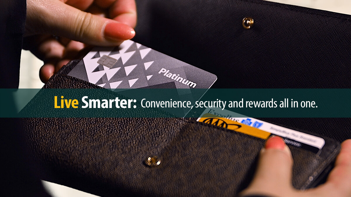 Woman's hand holding First Source Platinum credit card.