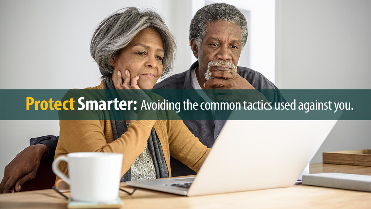 Senior African American couple using laptop.
