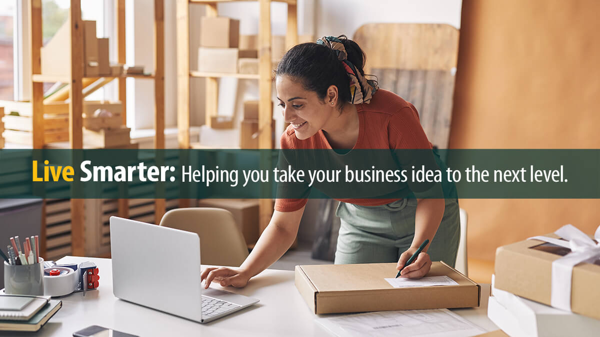 Woman completing orders by laptop