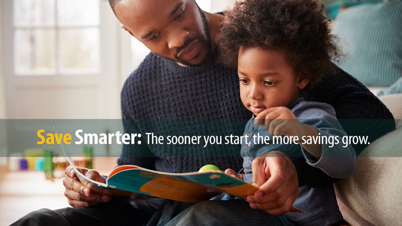 Father and toddler reading a book together