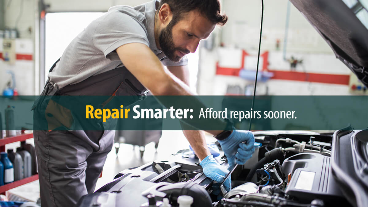 Young man repairing a car.