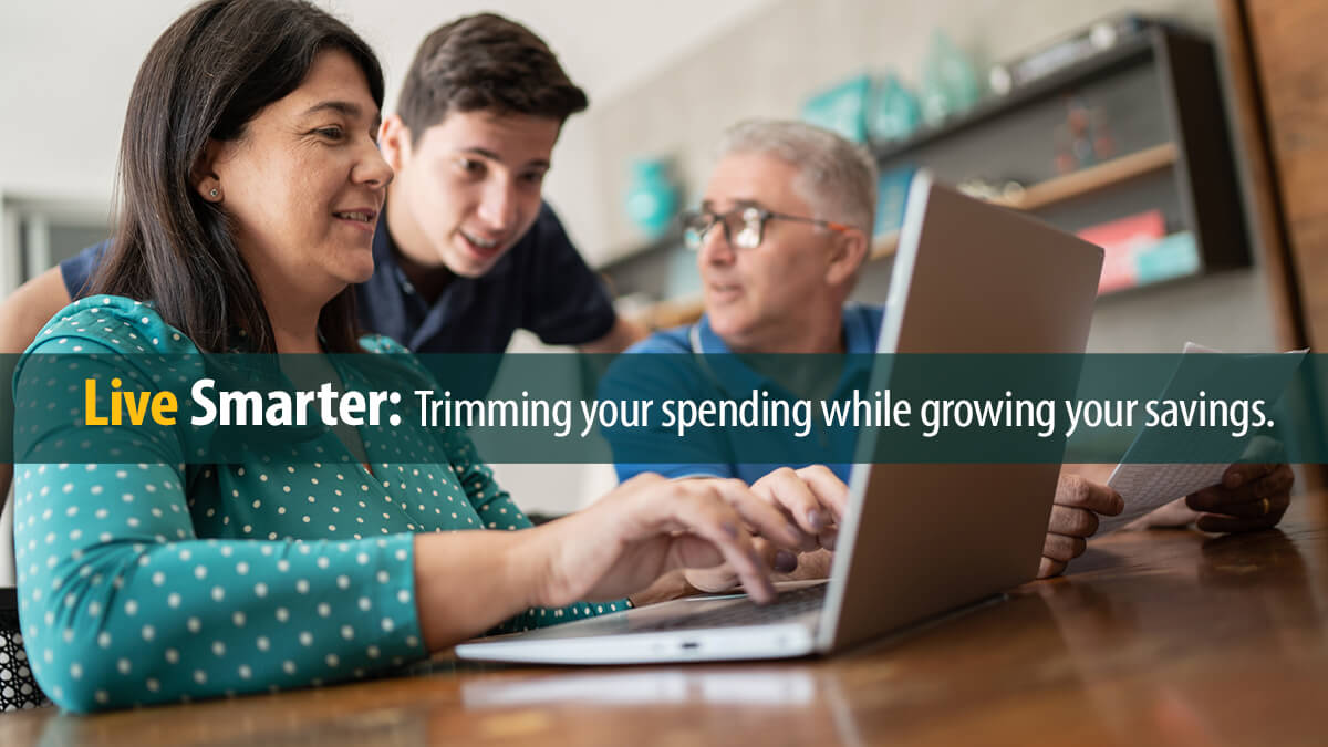 Parents doing home finances and talking to teenager son