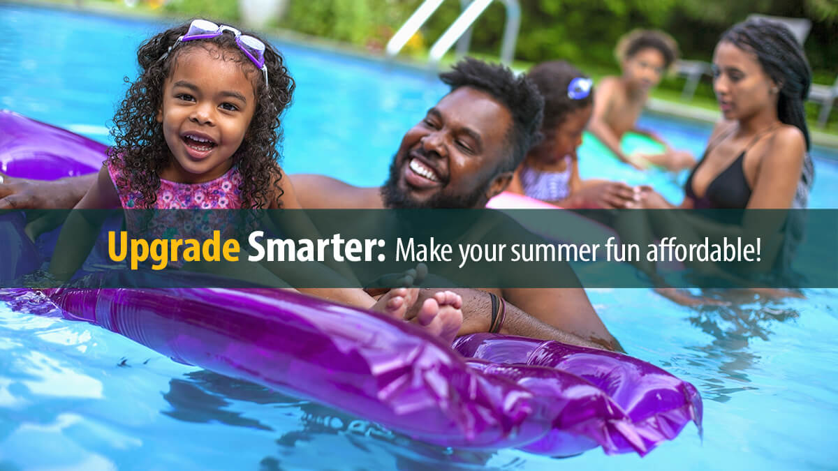 Young girl swimming on inflatable pool raft with her family