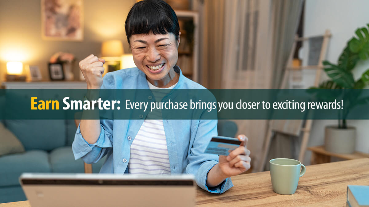 Cheerful woman using digital tablet and credit card at home