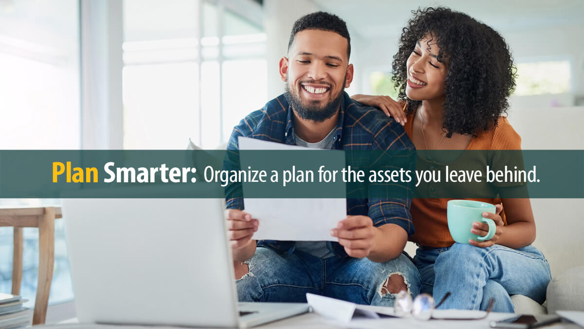 Happy young couple going over their finances at home