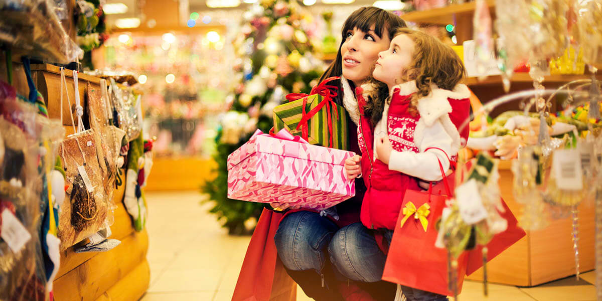 Mother and daughter buying Christmas items
